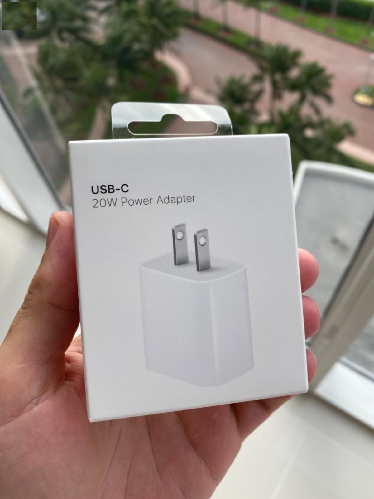 Close-up view of the Apple 20W USB-C Adapter showing the USB-C port and sleek design